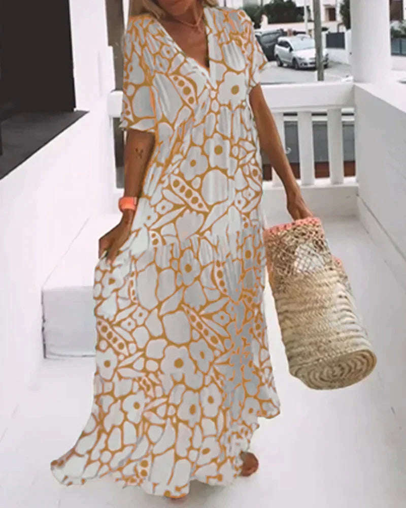 Vestido largo de verano con corte fluido y elegante estampado gráfico