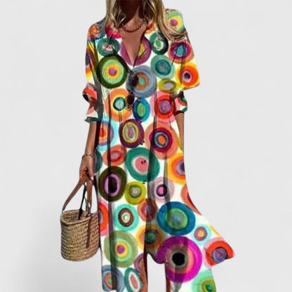 Vestido bohemio elegante con estampado artístico, escote en V con botones y falda midi fluida para mujer