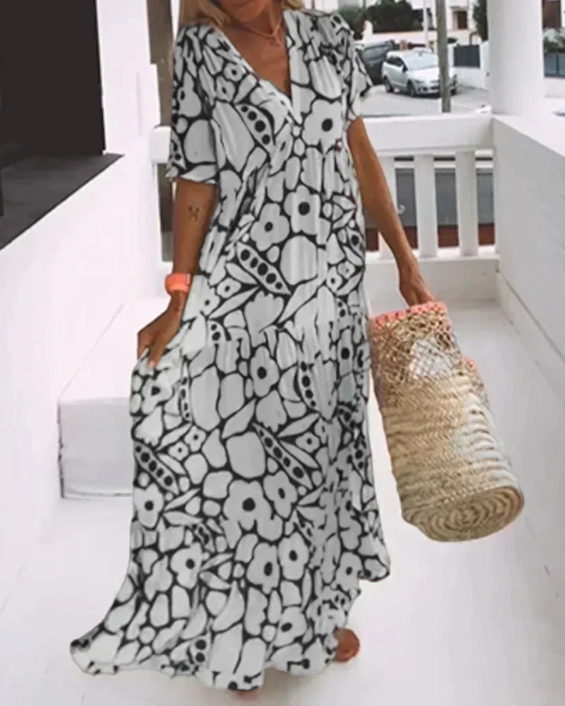 Vestido largo de verano con corte fluido y elegante estampado gráfico