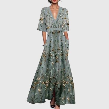 Vestido elegante de primavera con escote en V cruzado, estampado floral vibrante y falda maxi fluida para mujer