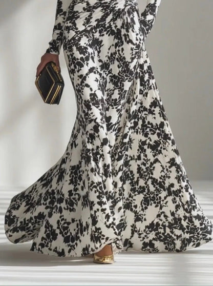 Vestido cruzado para mujer en blanco y negro con estampado artístico, tejido elástico y silueta elegante