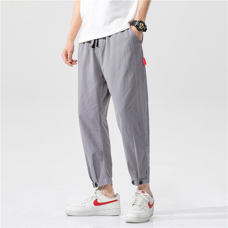 Pantalones ajustados para hombre confeccionados en tejido ligero y transpirable, con un corte moderno y un ajuste cómodo