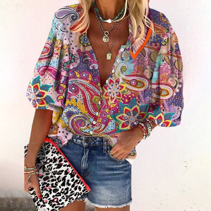 Blusa de vestir con estampado floral y manga tres cuartos