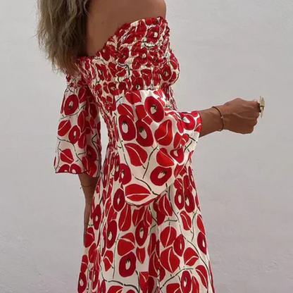 Vestido largo con estampado floral, hombros descubiertos y mangas acampanadas